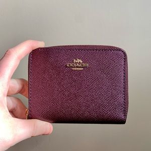 Purple coach wallet with gold tone hardware